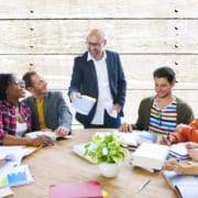 Team meeting at a wooden round table