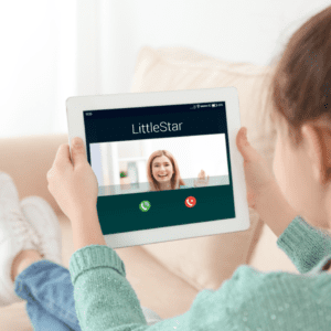 Child video chatting a LittleStar Behavioral Technician through the LittleStars Digital BCBA program