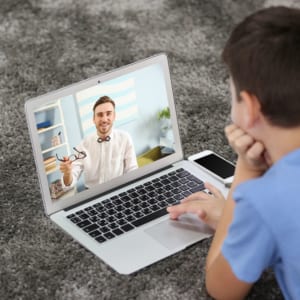 Child video chatting a LittleStar Behavioral Technician through the LittleStars Digital BCBA program